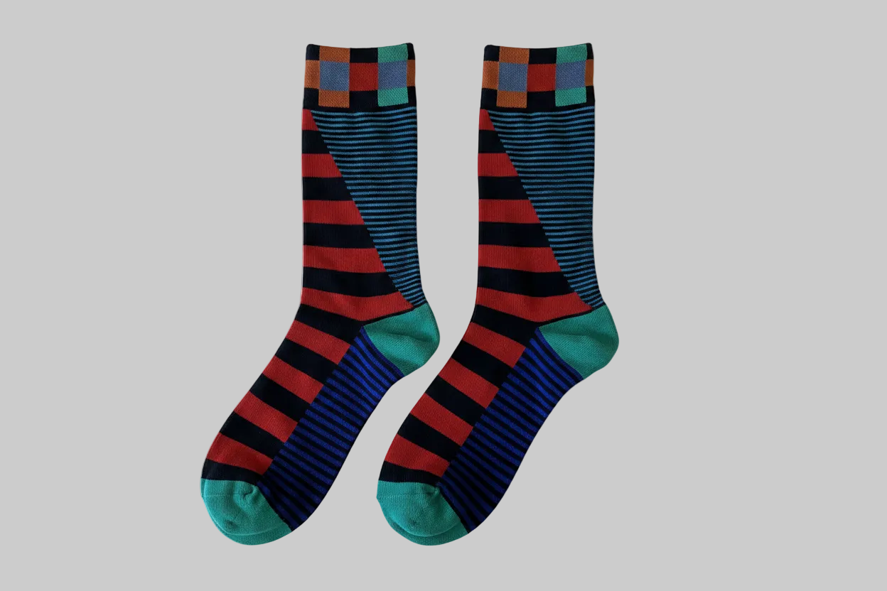 Two men's crew socks side by side with checkered cuff and stripe pattern